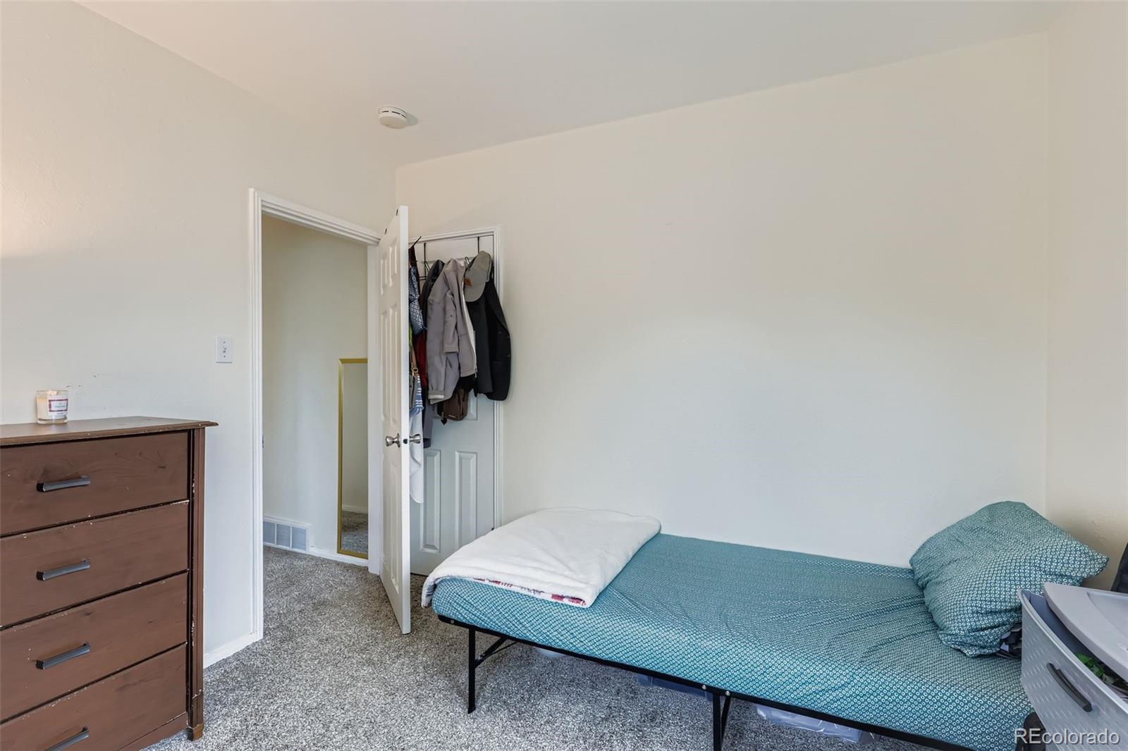 452 Perry Street Denver, CO 80204 - Photo 22 of 29 a living room with a bed and furniture