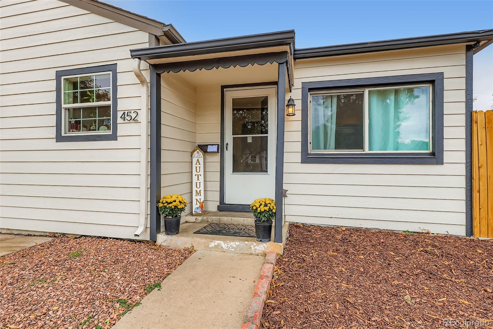 452 Perry Street Denver, CO 80204 - Photo 5 of 29 a front view of a house with a yard