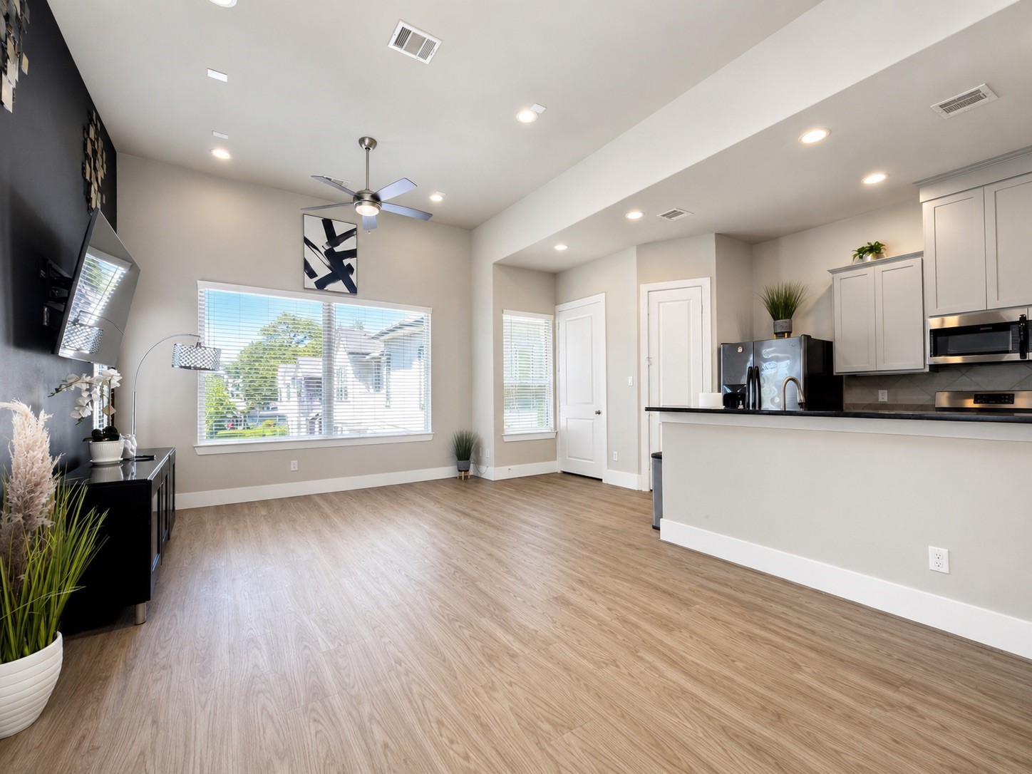 731 Janisch Road Houston, TX 77018 - Photo 14 of 19 Open concept Living/Dining & Kitchen upstairs with beautiful natural light and plenty of space to entertain. All TV mounts will stay with the home.