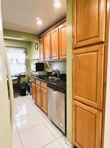 a kitchen with stainless steel appliances granite countertop a refrigerator sink and cabinets