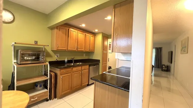 a kitchen with a sink and a refrigerator