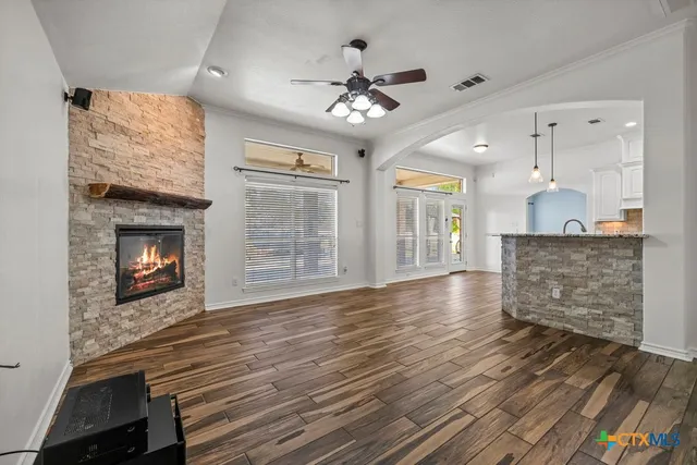 a living room with furniture and a fireplace