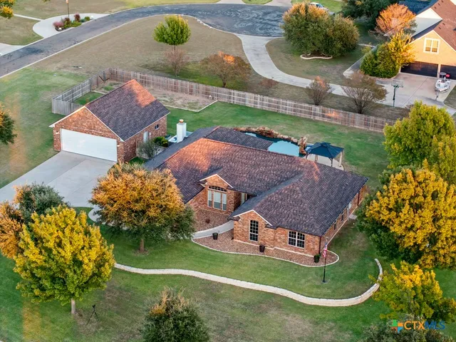 an aerial view of residential houses with outdoor space