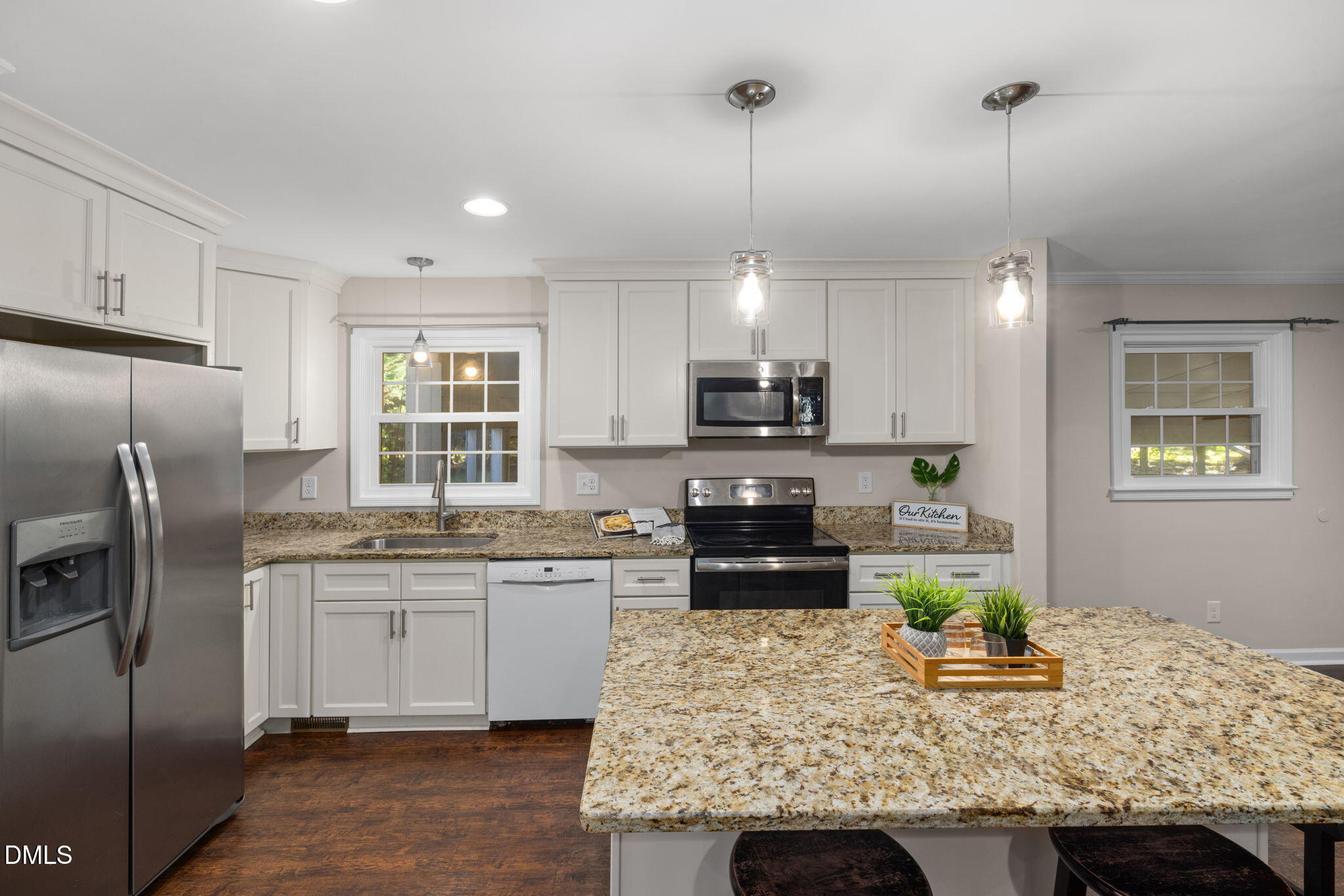 415 Bashford Road Raleigh, NC 27606 - Photo 12 of 33 a kitchen with kitchen island granite countertop a sink stove and refrigerator
