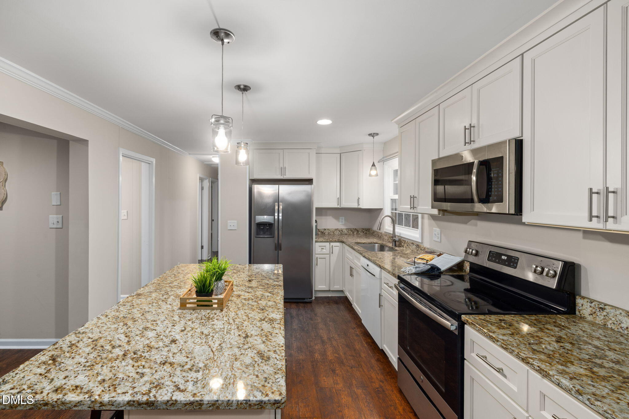 415 Bashford Road Raleigh, NC 27606 - Photo 14 of 33 a kitchen with stainless steel appliances granite countertop a stove refrigerator and microwave