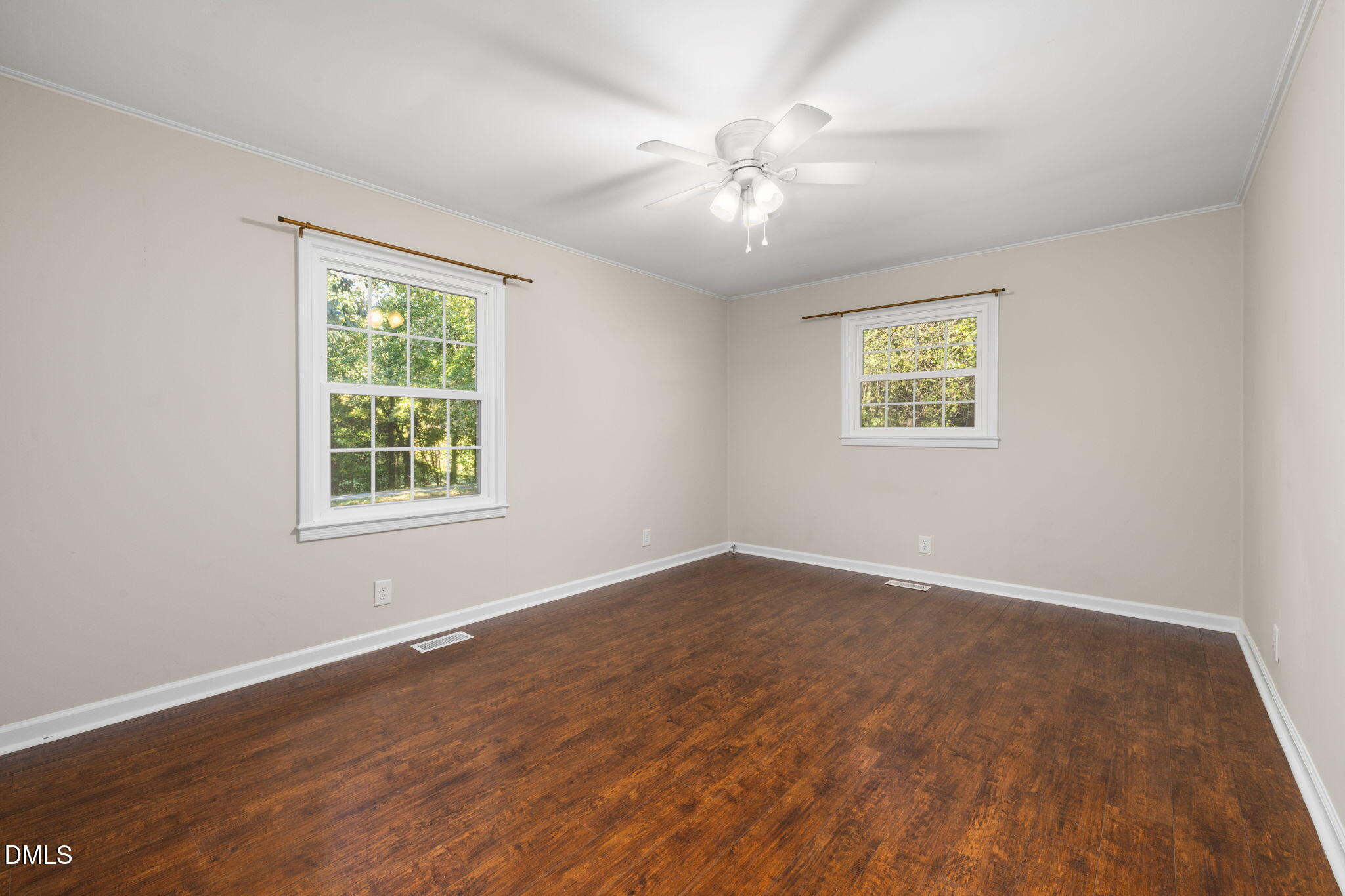 415 Bashford Road Raleigh, NC 27606 - Photo 26 of 33 a view of an empty room with wooden floor and a window
