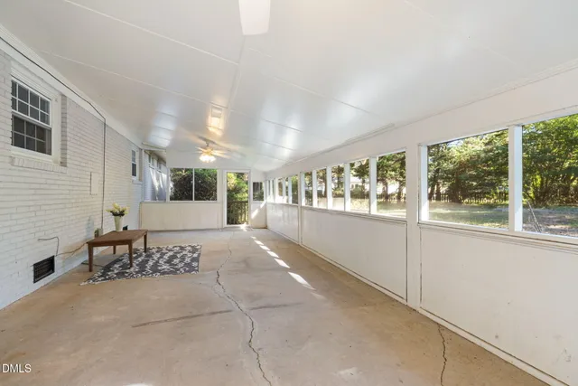 a view of a hallway with an entryway