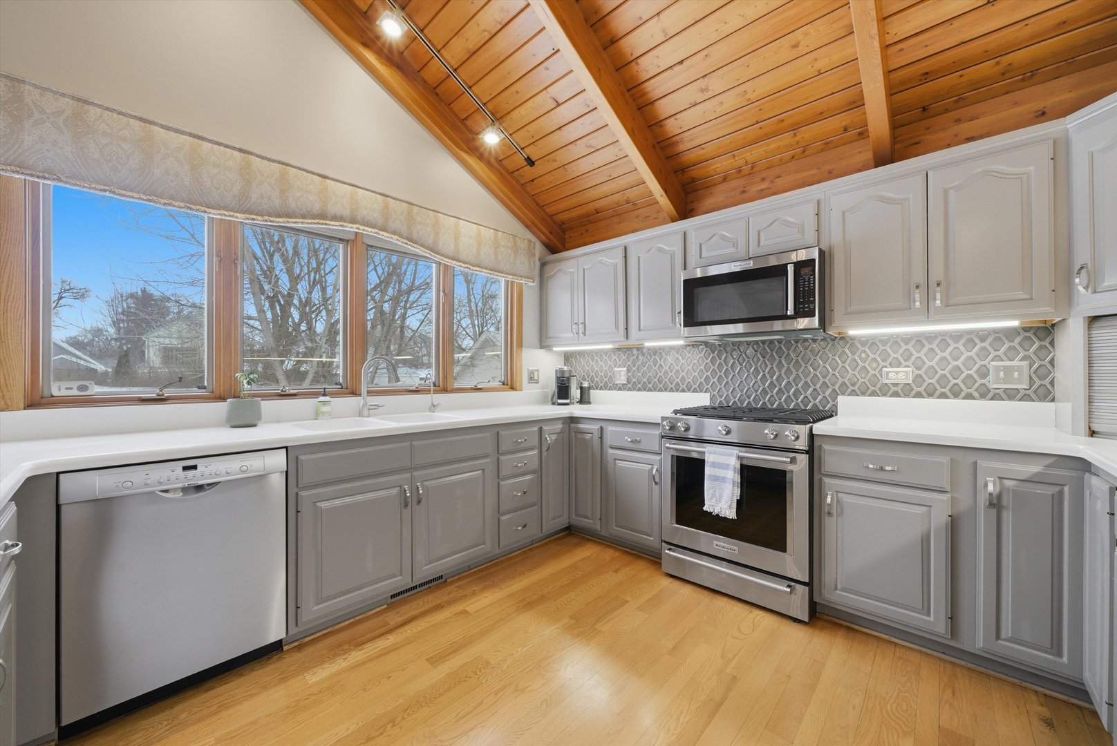 320 West Russell Street Barrington, IL 60010 - Photo 23 of 43 a kitchen with granite countertop a sink stainless steel appliances and cabinets