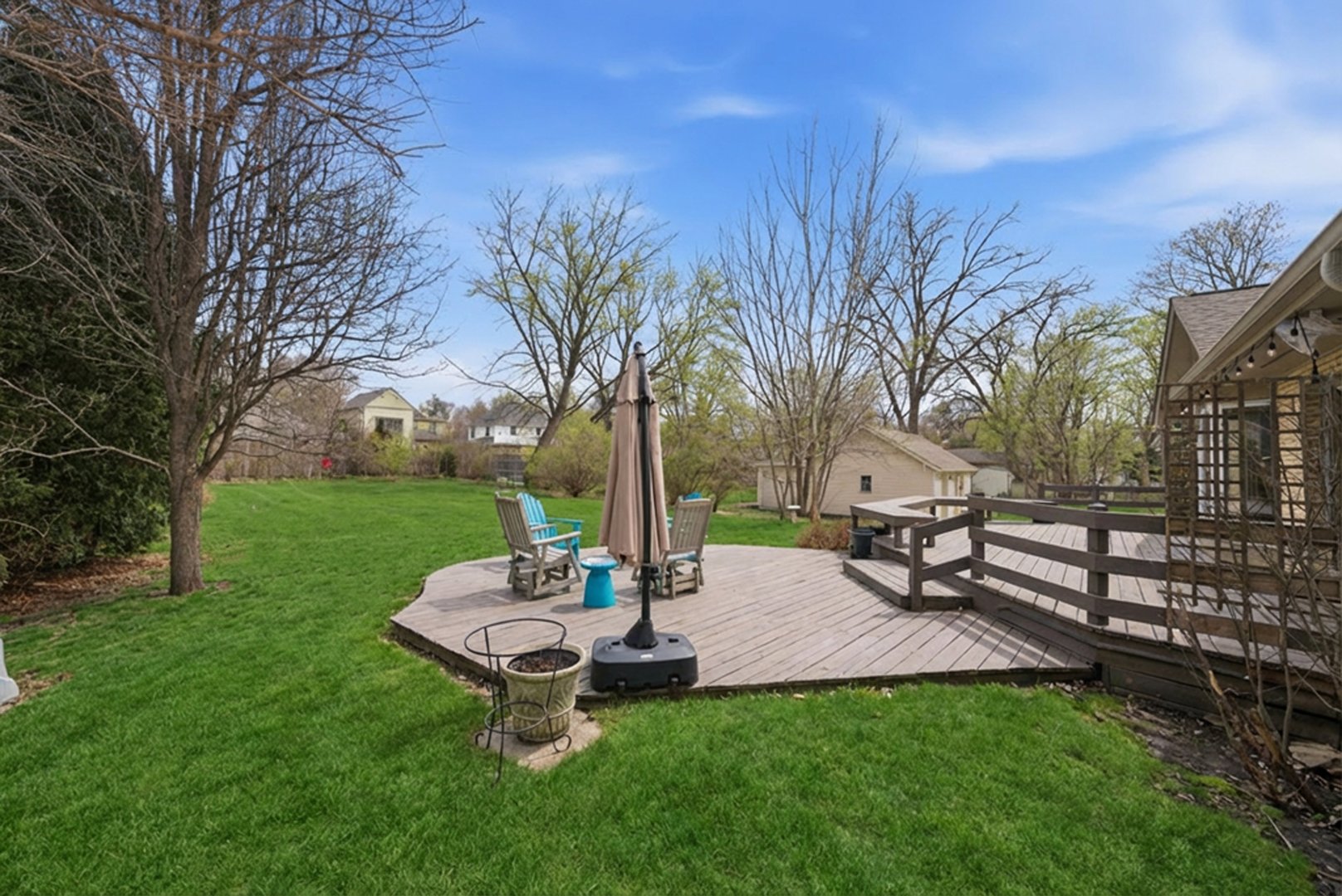 320 West Russell Street Barrington, IL 60010 - Photo 3 of 43 a view of a garden with a bench and trees