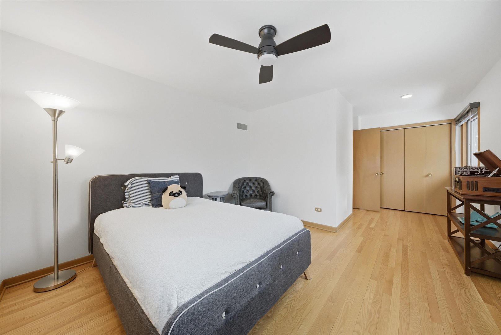 320 West Russell Street Barrington, IL 60010 - Photo 31 of 43 a spacious bedroom with a bed and a chandelier