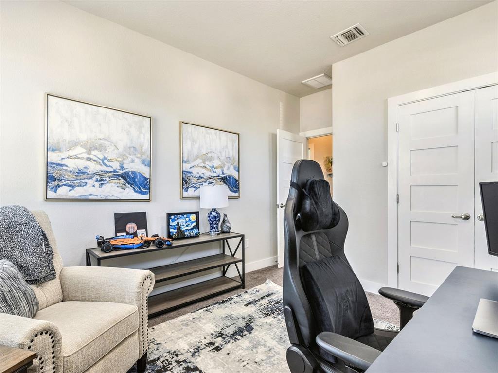 7001 Brick Slope Path Austin, TX 78744 - Photo 19 of 27 Office with light carpet