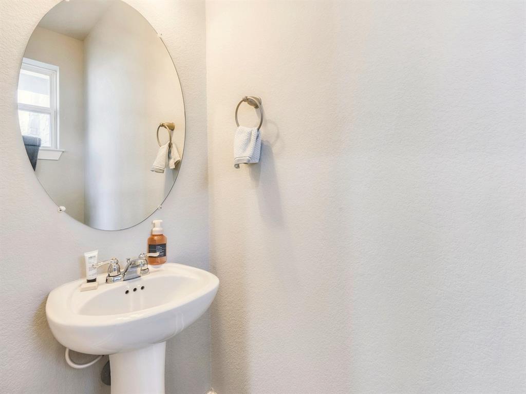 7001 Brick Slope Path Austin, TX 78744 - Photo 20 of 27 Bathroom with a sink