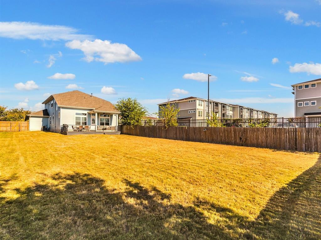 7001 Brick Slope Path Austin, TX 78744 - Photo 27 of 27 Fenced backyard featuring a patio