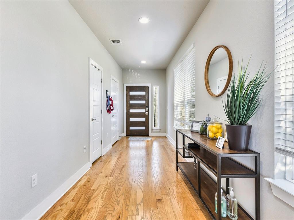 7001 Brick Slope Path Austin, TX 78744 - Photo 4 of 27 Entrance foyer with light wood-style flooring and recessed lighting