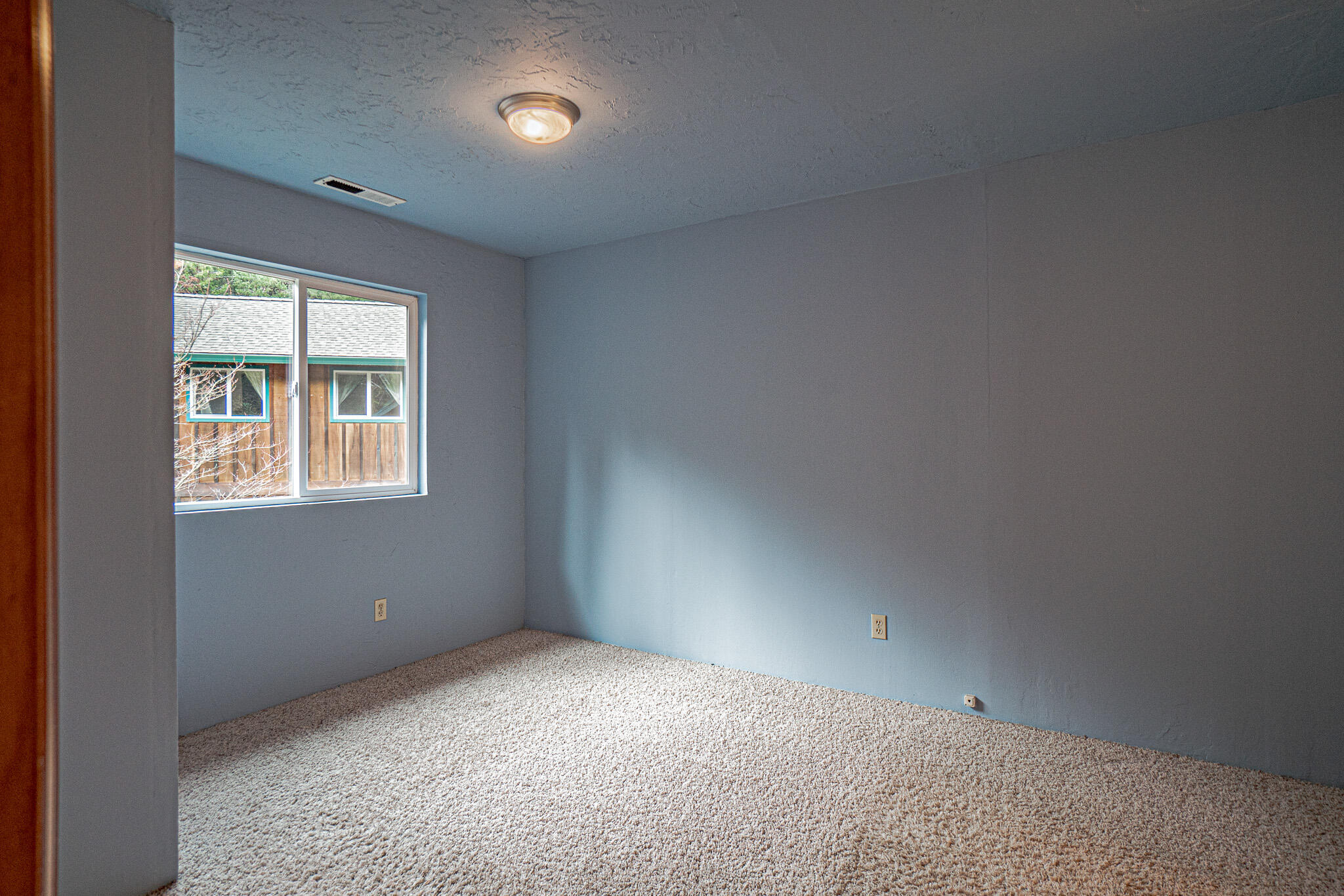 2728 Anderson Creek Road Talent, OR 97540 - Photo 21 of 45 an empty room with a window
