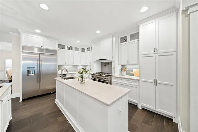 a bedroom with a bed and a view of kitchen