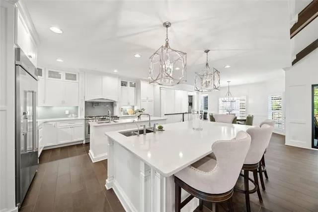 a bathroom with a double vanity sink mirror double and shower