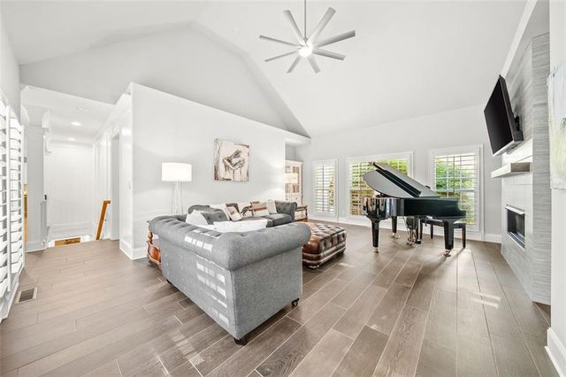 a view of an empty room with wooden floor