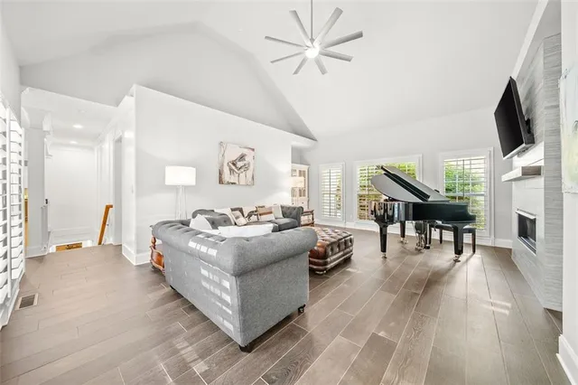 a view of an empty room with wooden floor