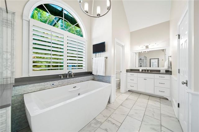 a view of an outdoor sitting area with furniture and garden view