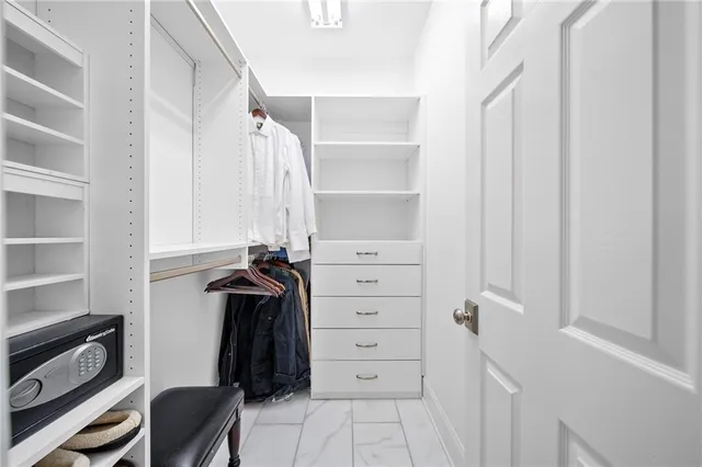 a view of a patio with table and chairs with wooden floor and fence