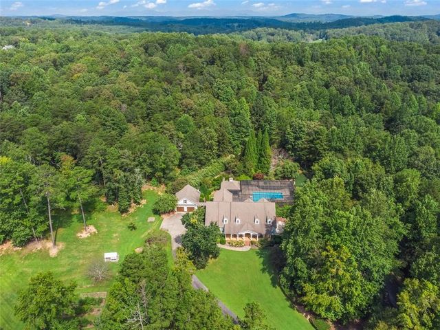 a living room with furniture fireplace and a window