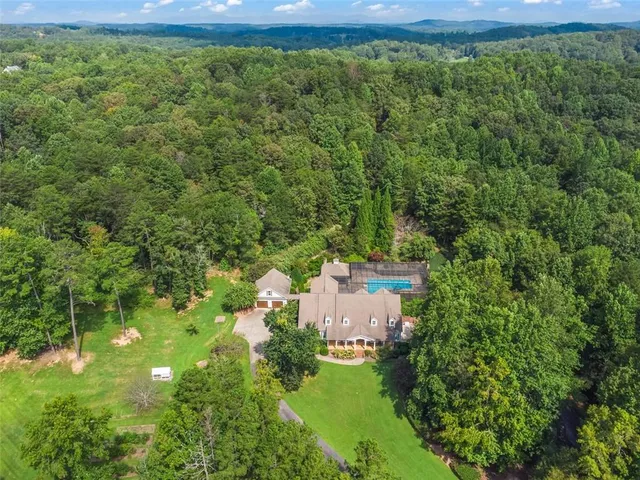 a living room with furniture fireplace and a window