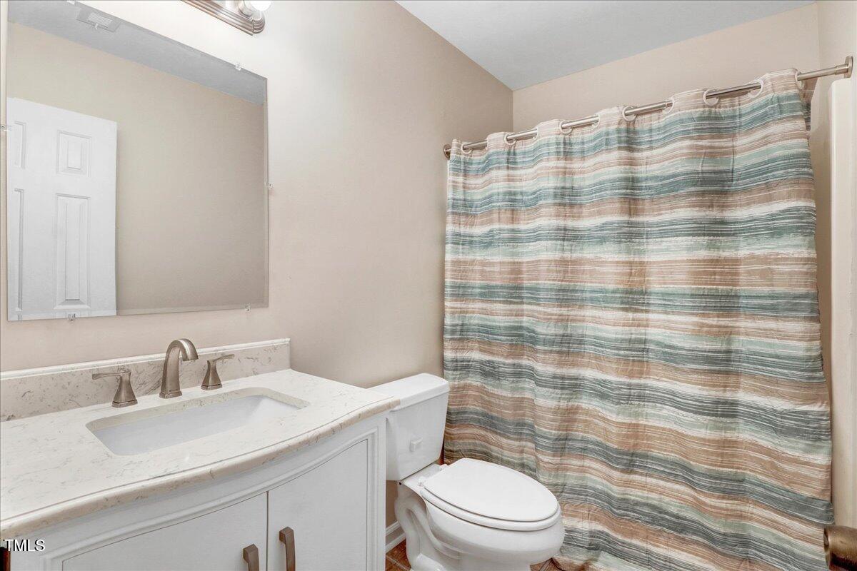 216 Bracken Court Raleigh, NC 27615 - Photo 16 of 27 1st Floor Guest Bathroom