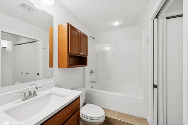 a kitchen with a sink stove and microwave