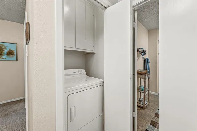 a bedroom with a bed next to a window