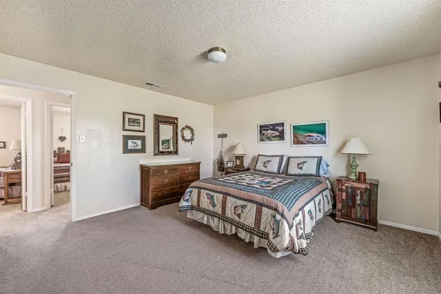 a bedroom with two beds and a window