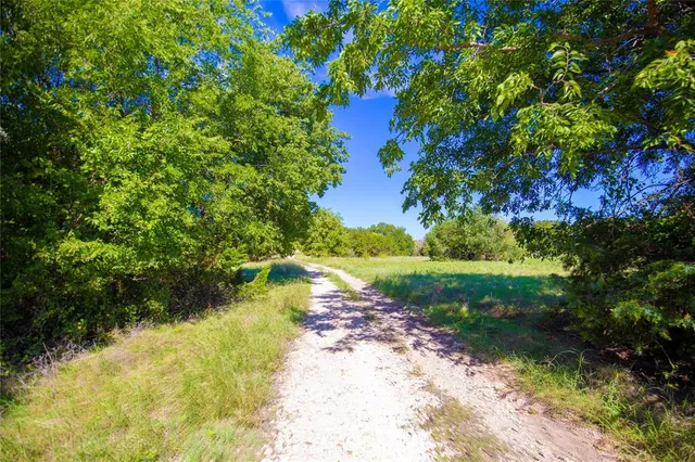 a view of a lake with a house in the background