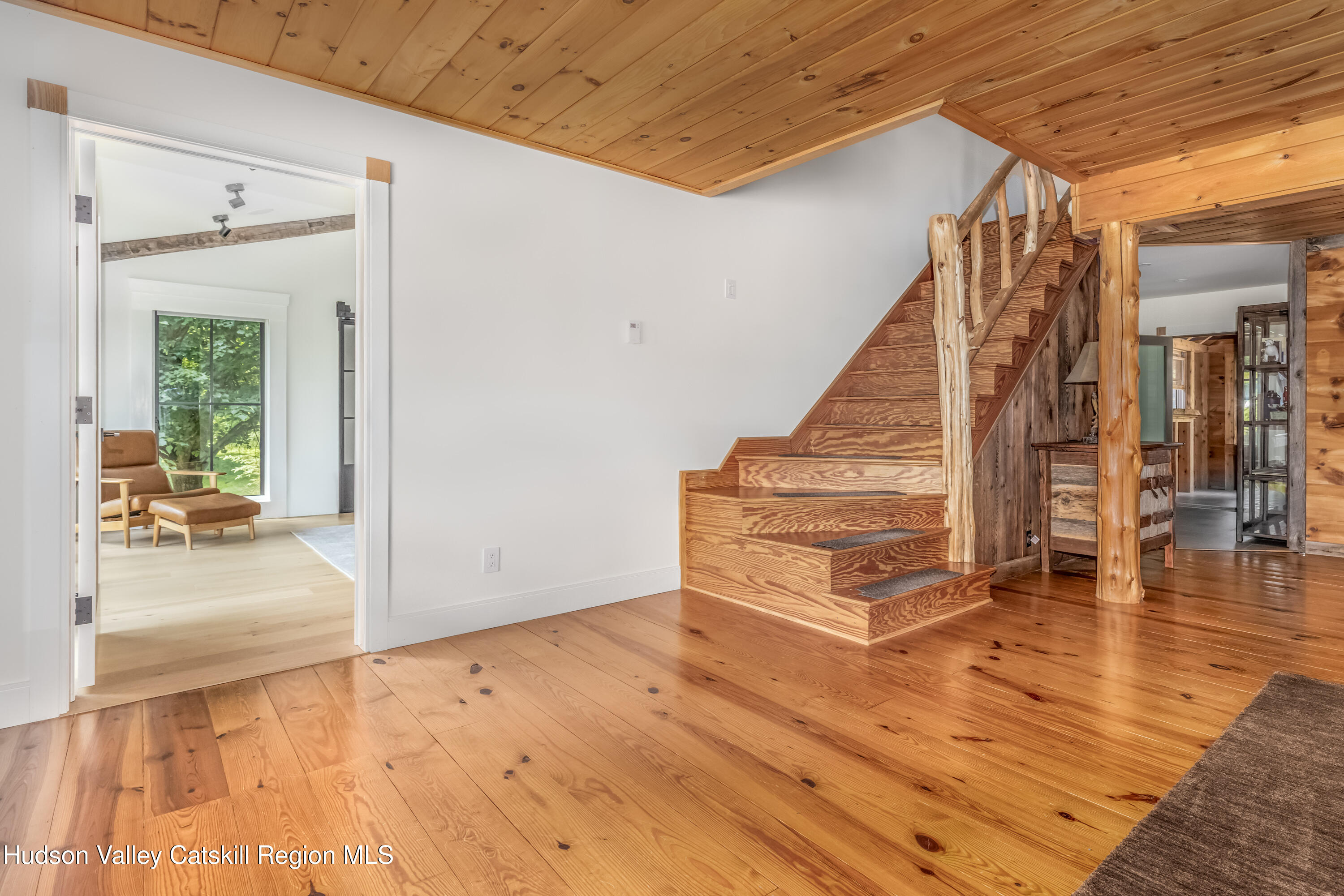 688 Bruce Porn Road Gilboa, NY 12167 - Photo 58 of 104 a view of a livingroom with wooden floor and stairs