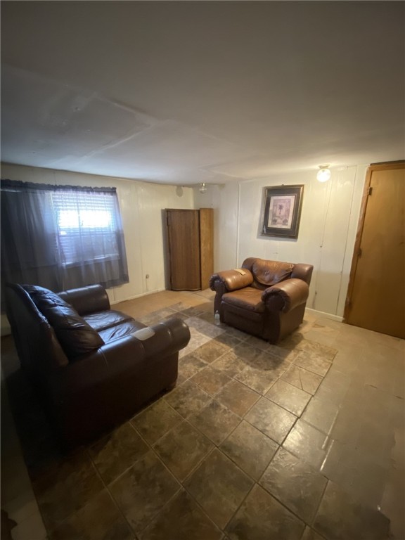 421 Northeast 5th Street Premont, TX 78375 - Photo 9 of 17 a living room with furniture and a window