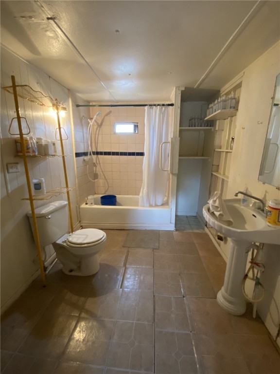 421 Northeast 5th Street Premont, TX 78375 - Photo 10 of 17 a bathroom with a toilet sink and shower