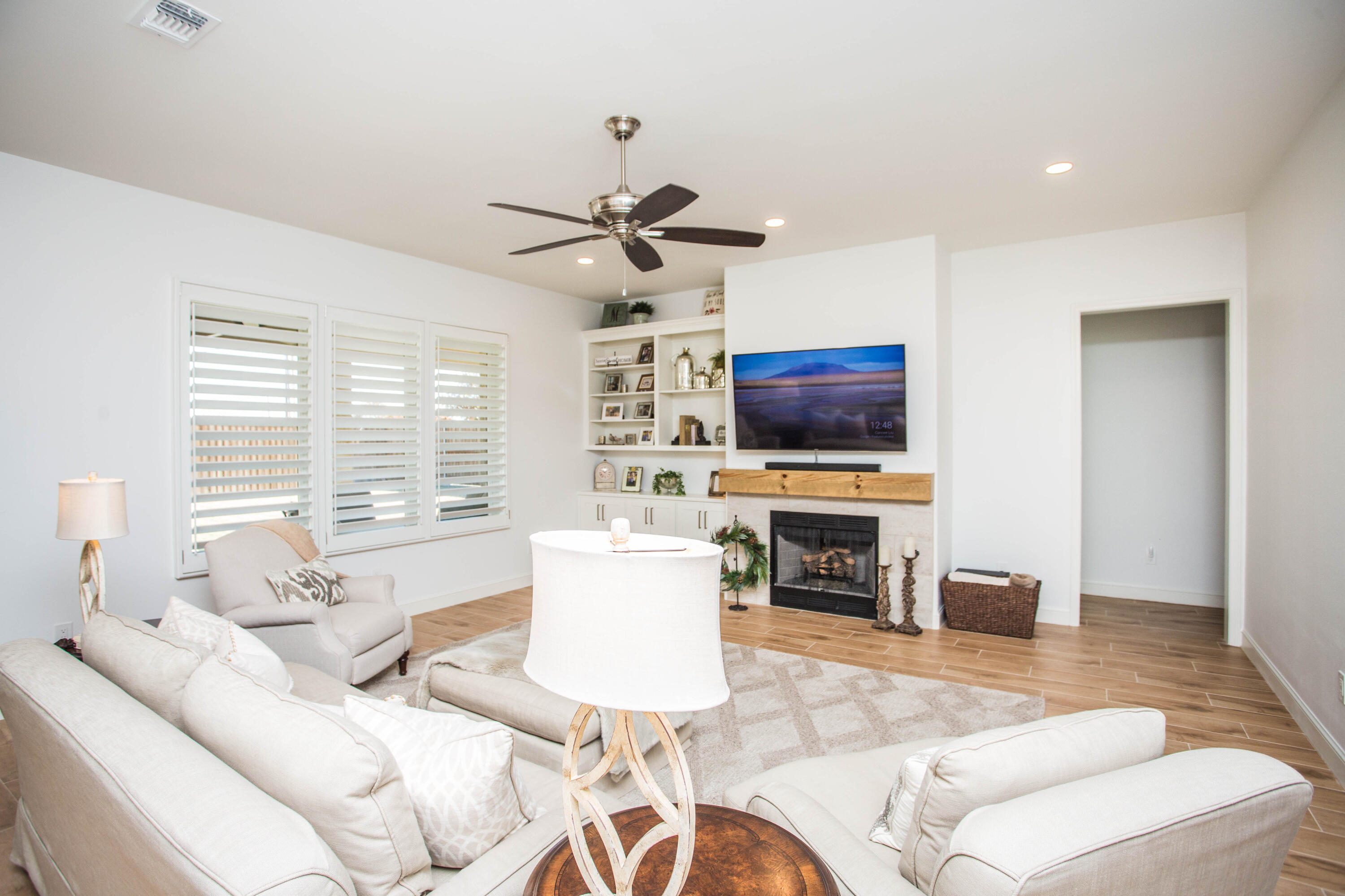 209 South Holliday Plainview, TX 79072 - Photo 2 of 29 a living room with furniture a fireplace and a flat screen tv