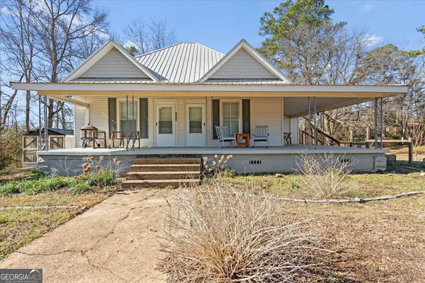 front view of a house with a swimming pool
