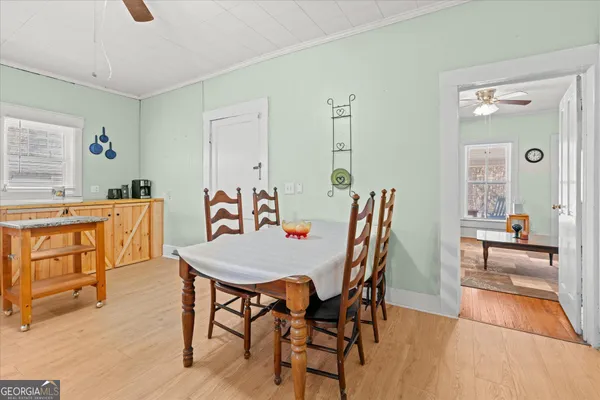 a dining room with furniture and window