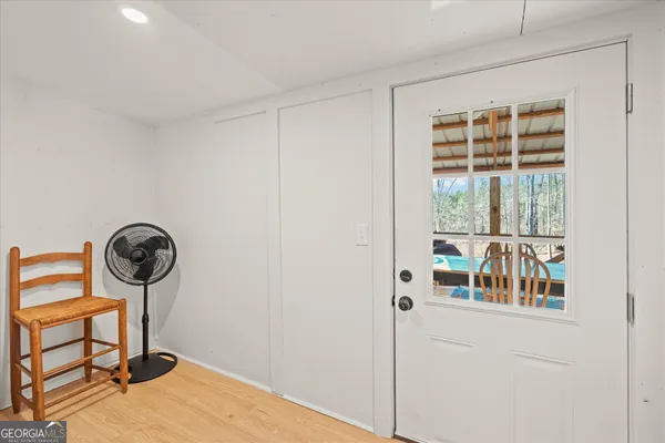 a view of entryway with wooden floor