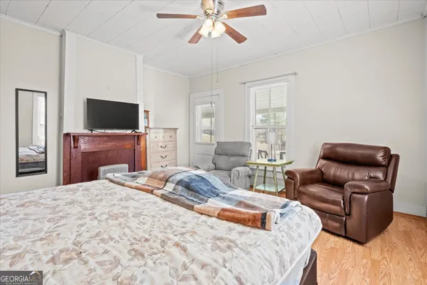 a bedroom with a bed and a couch