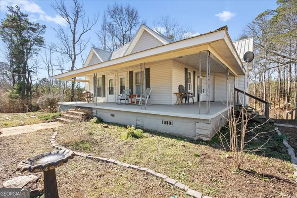 a front view of house with yard outdoor seating