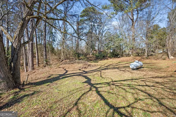 a view of a backyard of the house