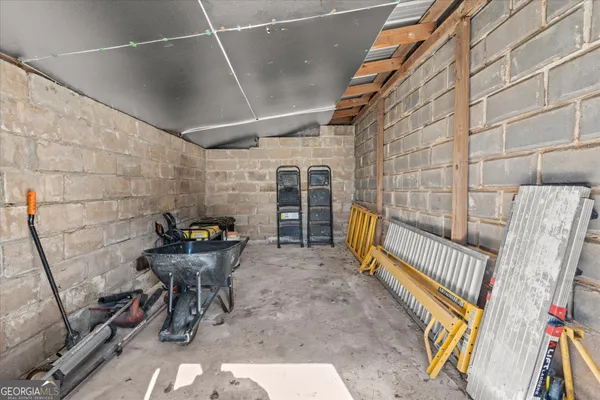 a view of a porch with furniture and next to a bench