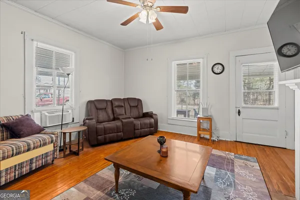a living room with furniture and a window