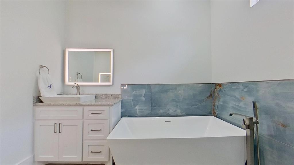 3248 North Cardinal Road Azle, TX 76020 - Photo 18 of 29 Freestanding soaking tub with a floor-mounted brushed nickel filler