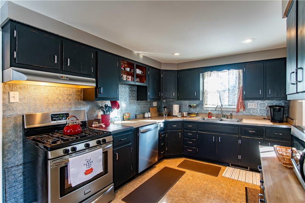 1146 Chestnut Street Monaca, PA 15061 - Photo 12 of 37 a kitchen with lots of counter top space and wooden floor