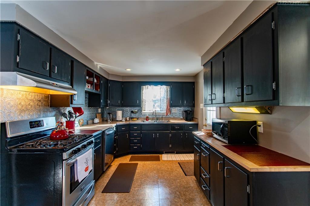 1146 Chestnut Street Monaca, PA 15061 - Photo 13 of 37 a kitchen with lots of counter top space and stove top oven