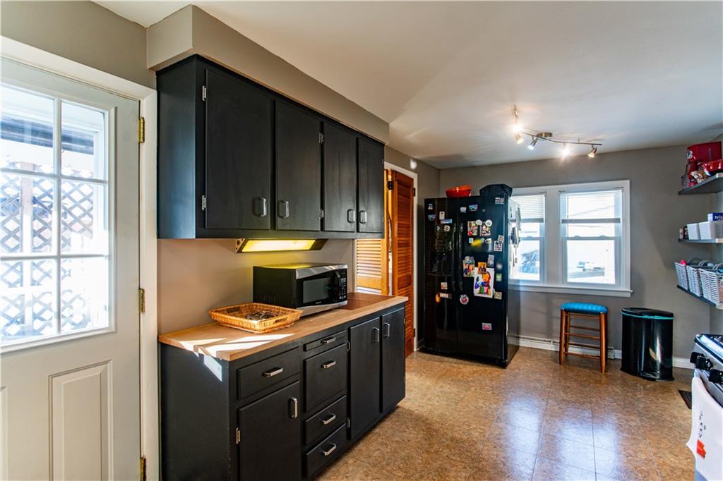 1146 Chestnut Street Monaca, PA 15061 - Photo 15 of 37 a kitchen with a refrigerator and window