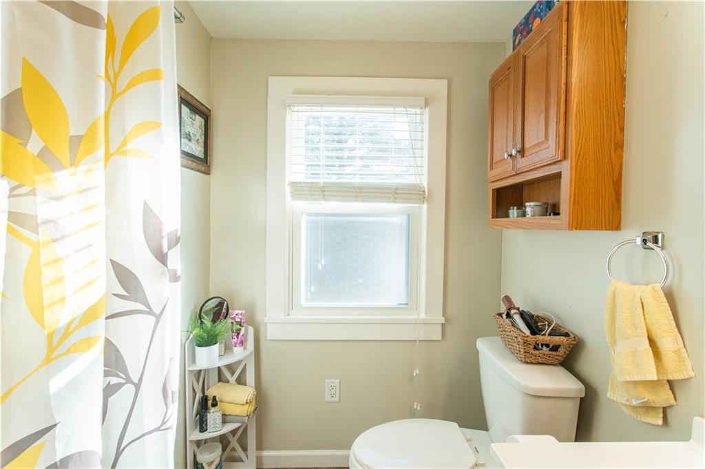 1146 Chestnut Street Monaca, PA 15061 - Photo 19 of 37 a bathroom with a sink a toilet and a window