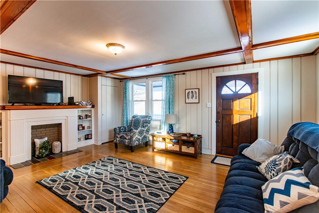1146 Chestnut Street Monaca, PA 15061 - Photo 2 of 37 a living room with furniture fireplace and flat screen tv